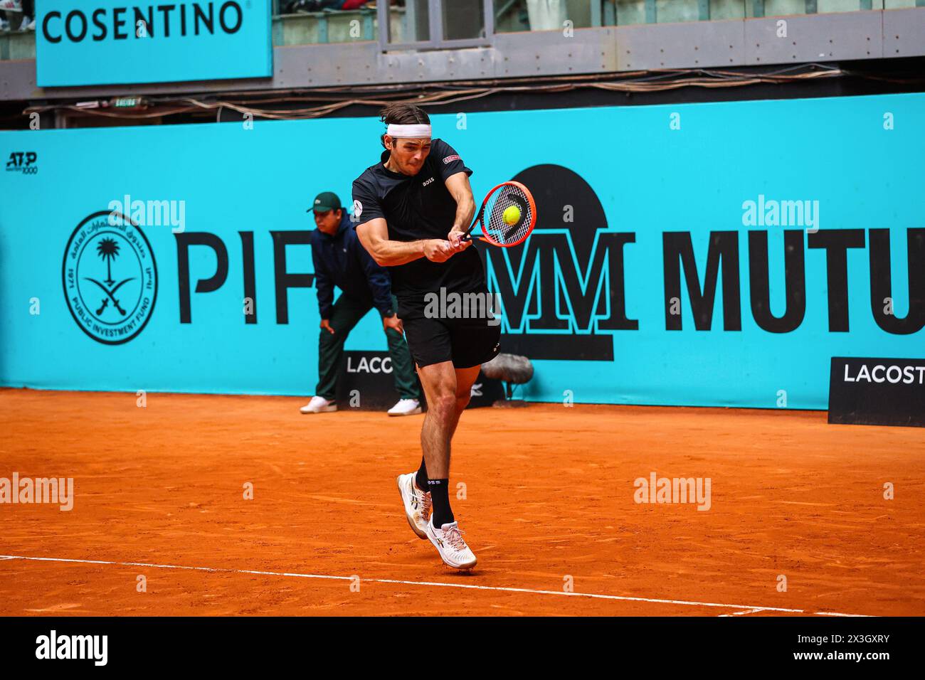 Madrid, Spain. 26th Apr, 2024. Taylor Fritz of the USA plays against Luciano Darderi of Italy on Day Five of the Mutua Madrid Open 2024 tournament at La Caja Magica. Taylor Fritz won against Luciano Darderi 7-6, 6-4 Credit: SOPA Images Limited/Alamy Live News Stock Photo