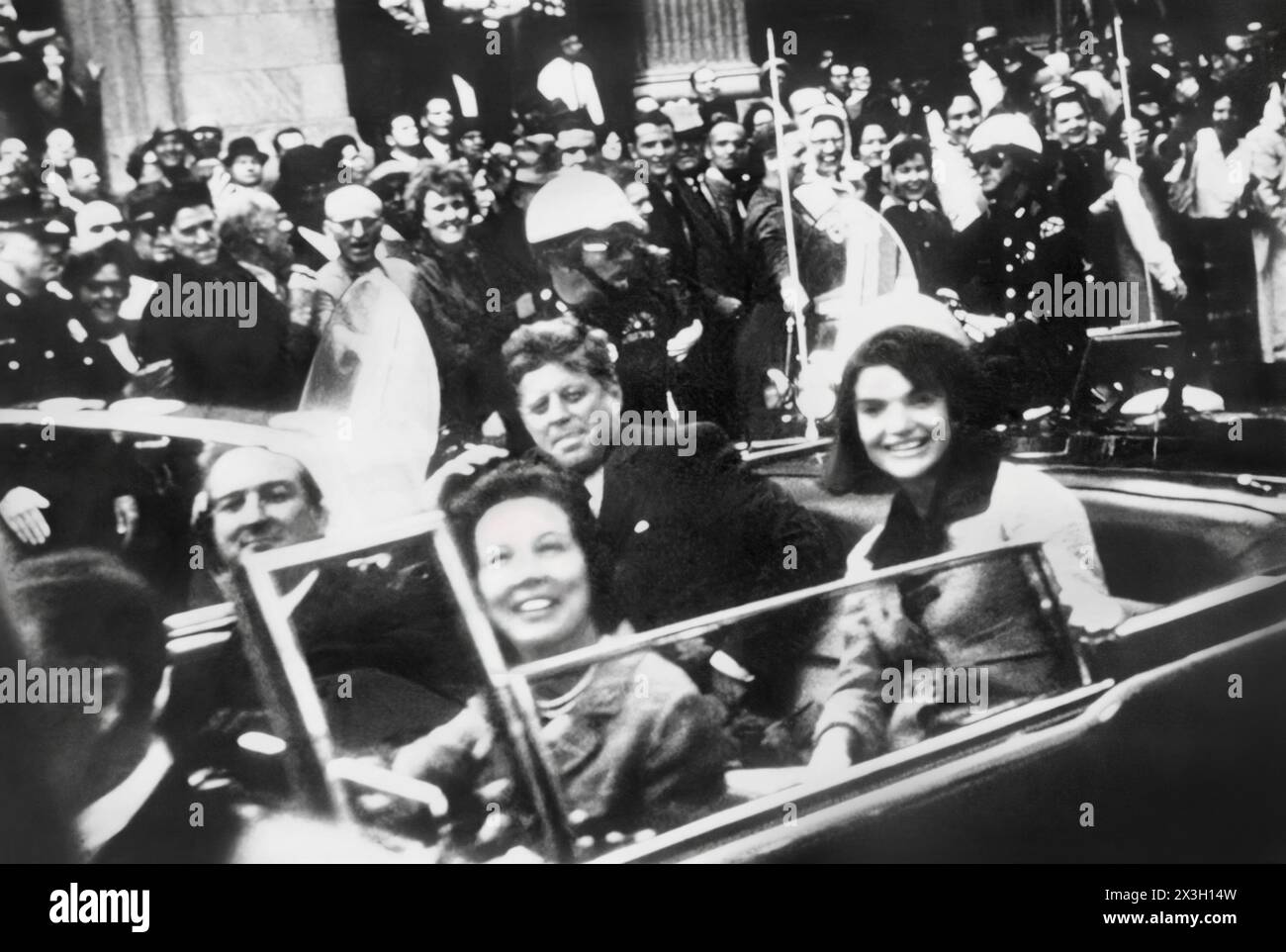 President John F. Kennedy and Jaqueline Kennedy with Texas Governor John Connally and wife in downtown Dallas motorcade on November 22, 1963 prior to President Kennedy's assassination. (USA) Stock Photo