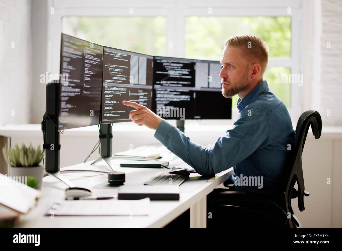 Web Developer Coding On Computer To Develop Code Stock Photo