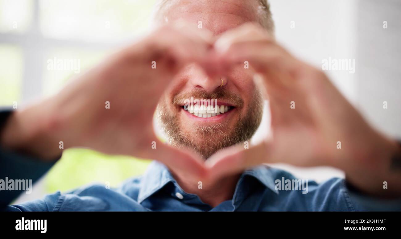 Man Making Heart Sign. Senior Hands Romantic Love Stock Photo