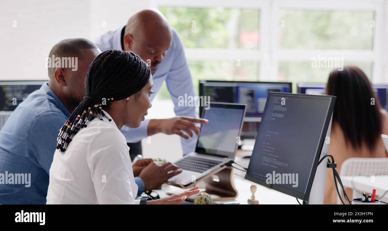 African developer team working on computer code for business Stock Photo