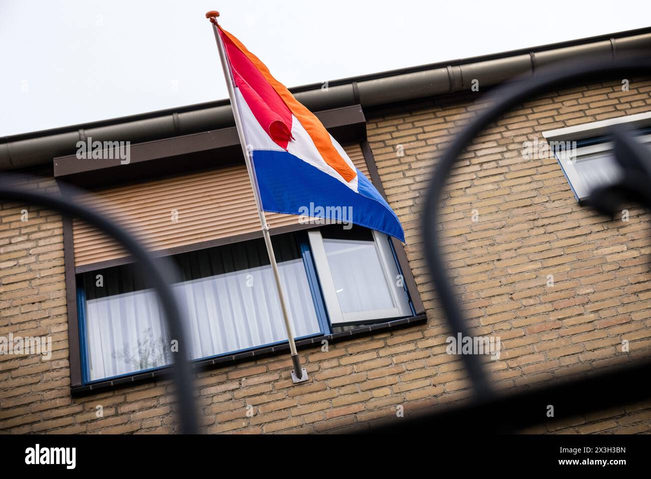 MIERLO - The Dutch flag with an orange pennant is flying for King's Day. While the royal family visits Emmen, the national holiday is also being fully celebrated in the rest of the country. ANP ROB ENGELAAR netherlands out - belgium out Stock Photo