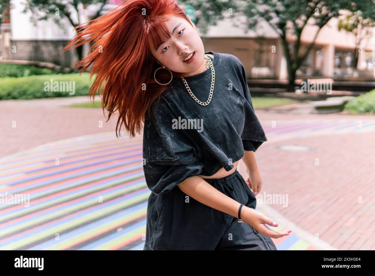 Korean urban dancer expressing freedom and joy amidst the city's ...