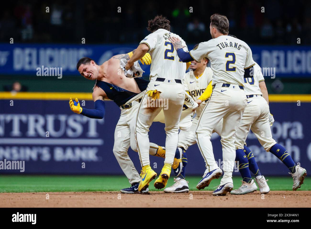 Milwaukee, WI, USA. 26th Apr, 2024. Milwaukee Brewers third base Joey Ortiz (3) has his jersey torn off by celebrating teammates after his walk-off hit RBI after the game between the Milwaukee Brewers and the New York Yankees at American Family Field in Milwaukee, WI. Darren Lee/CSM (Credit Image: © Darren Lee/Cal Sport Media). Credit: csm/Alamy Live News Stock Photo