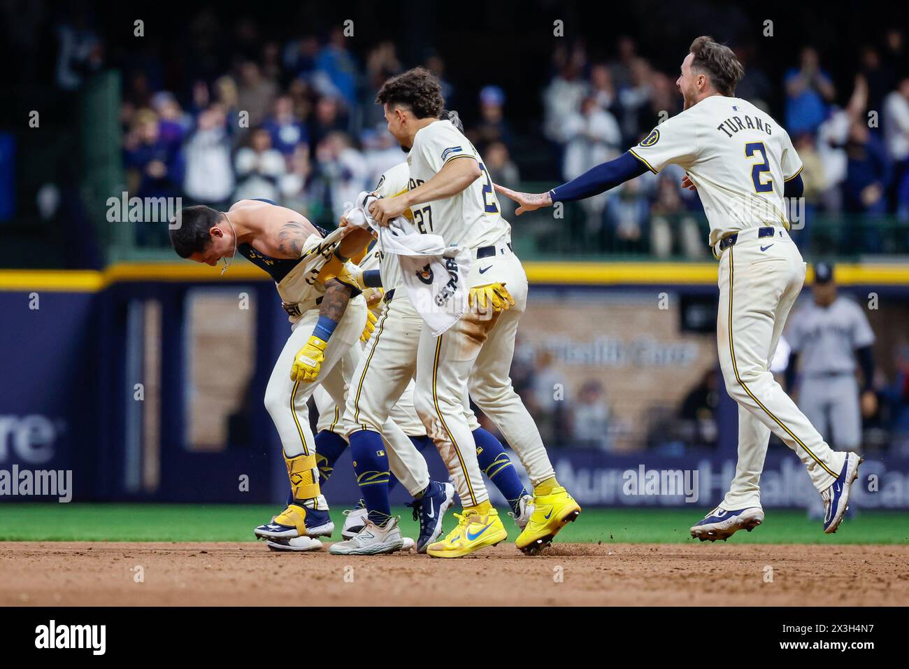 Milwaukee, WI, USA. 26th Apr, 2024. Milwaukee Brewers third base Joey Ortiz (3) has his jersey torn off by celebrating teammates after his walk-off hit RBI after the game between the Milwaukee Brewers and the New York Yankees at American Family Field in Milwaukee, WI. Darren Lee/CSM (Credit Image: © Darren Lee/Cal Sport Media). Credit: csm/Alamy Live News Stock Photo