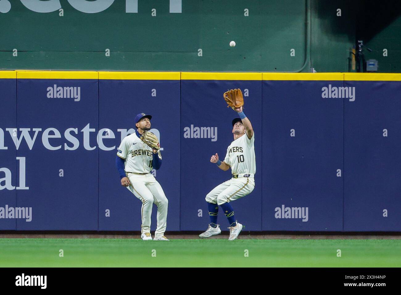 Milwaukee, WI, USA. 26th Apr, 2024. Milwaukee Brewers outfielder Sal Frelick (10) makes a catch as outfielder Blake Perkins (16) watches during the game between the Milwaukee Brewers and the New York Yankees at American Family Field in Milwaukee, WI. Darren Lee/CSM/Alamy Live News Stock Photo