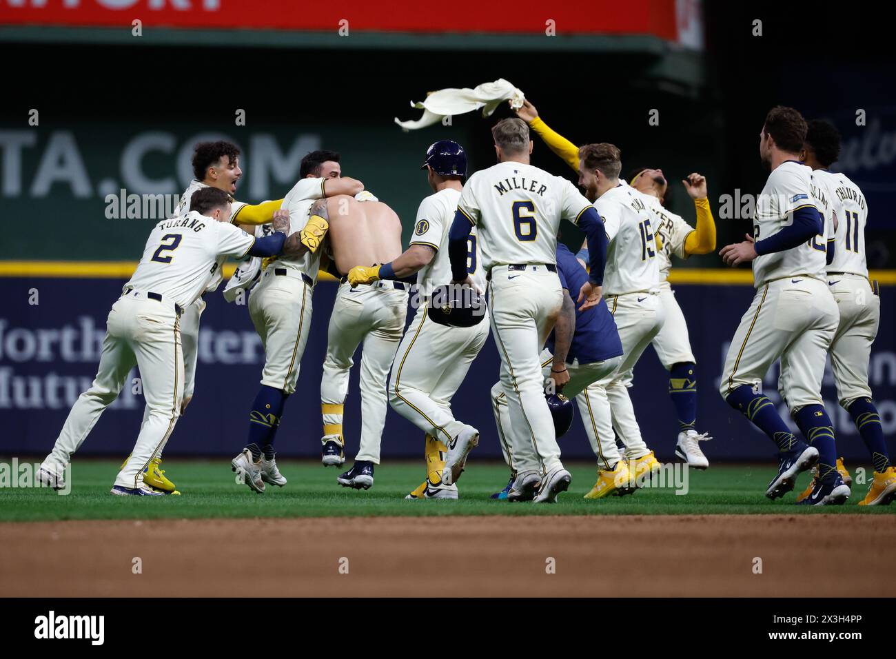 Milwaukee, WI, USA. 26th Apr, 2024. Milwaukee Brewers third base Joey Ortiz (3) has his jersey torn off by celebrating teammates after his walk-off hit RBI after the game between the Milwaukee Brewers and the New York Yankees at American Family Field in Milwaukee, WI. Darren Lee/CSM/Alamy Live News Stock Photo
