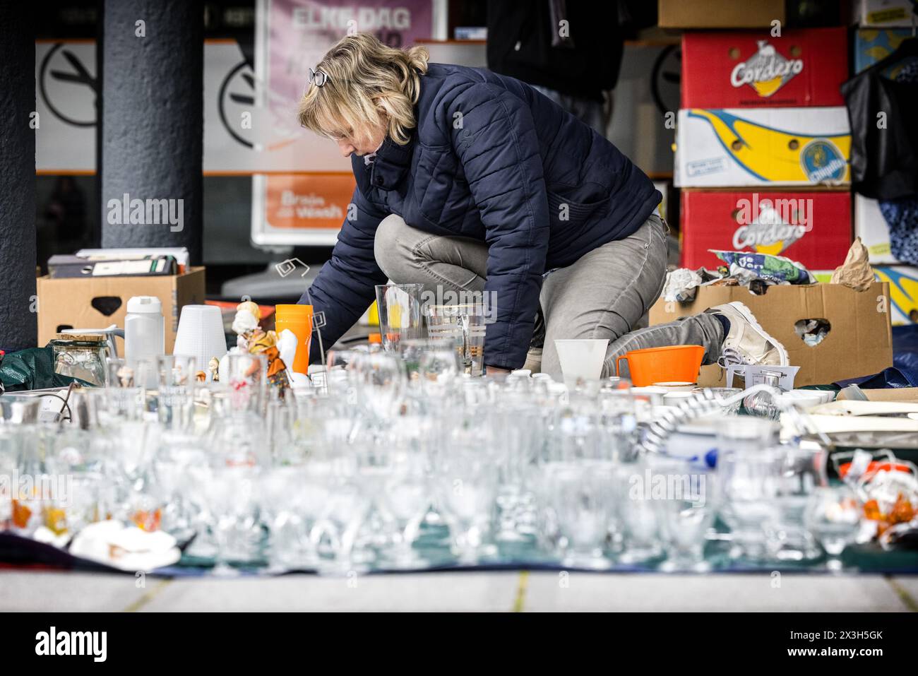 VELDHOVEN - People prepare for the flea market during the celebration of King's Day. While the royal family visited Emmen, the national holiday was also fully celebrated in the rest of the country. ANP ROB ENGELAAR netherlands out - belgium out Stock Photo