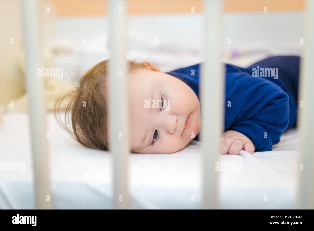 Toddler standing in baby crib hires stock photography and images Alamy