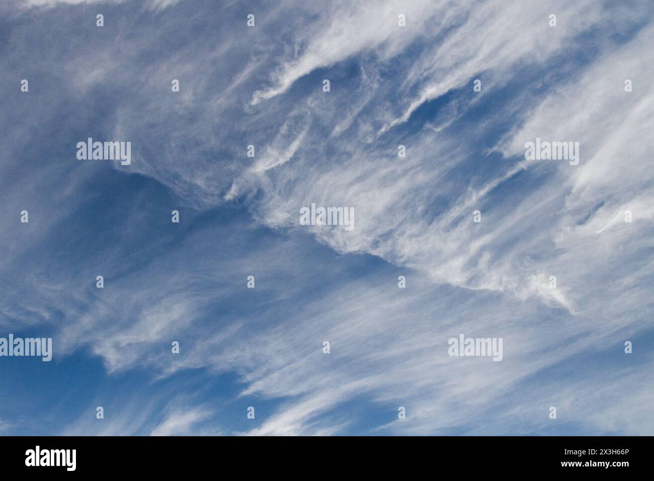 Wispy cirrus clouds clouds in a blue sky. Japan. Stock Photo