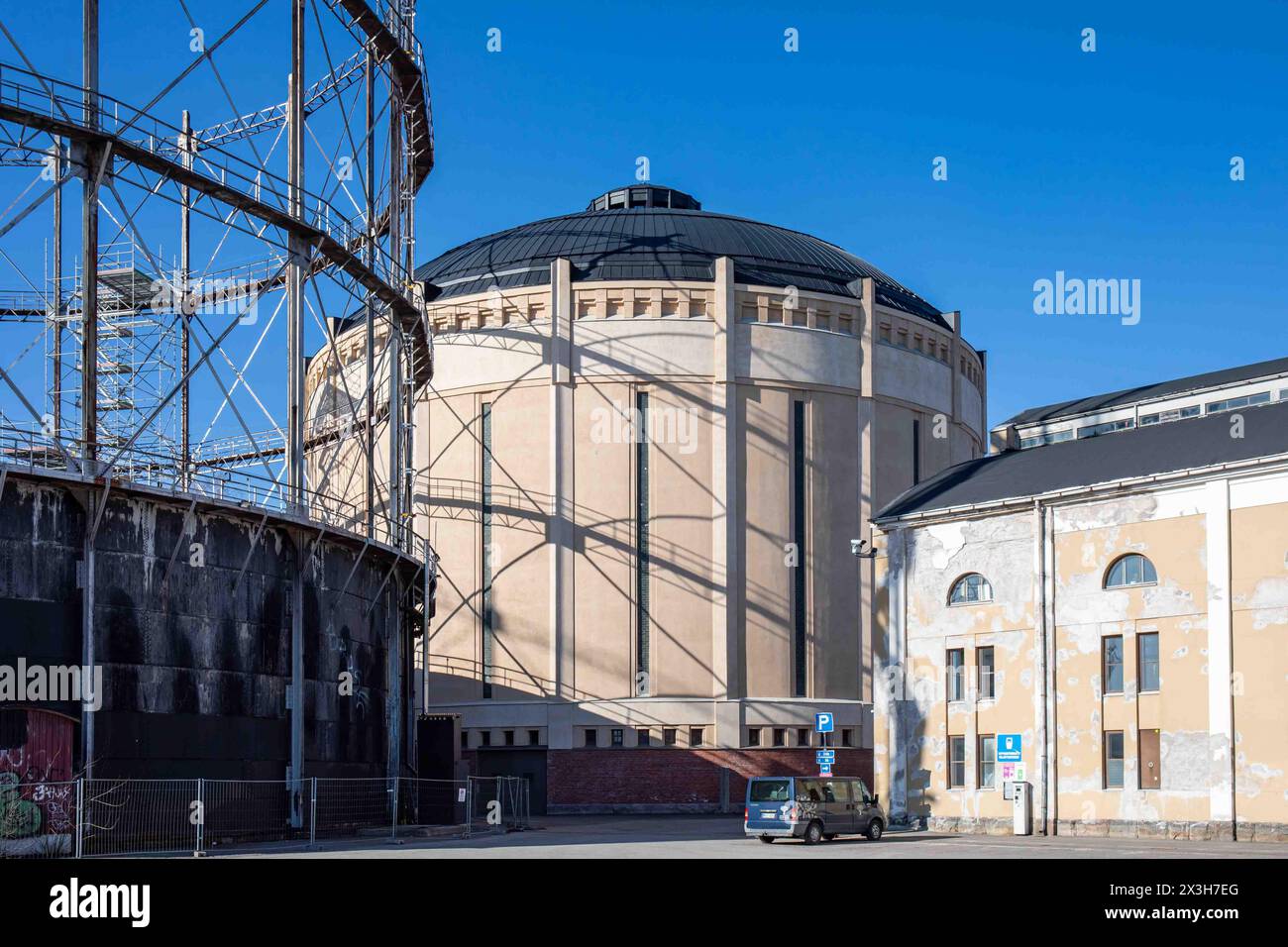 Old gasometers or gas holders against clear blue sky in Suvilahti district of Helsinki, Finland Stock Photo