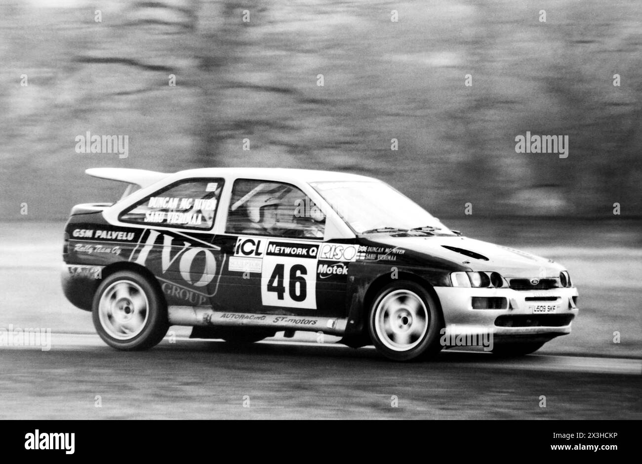 Driver Saku Vierimaa and co-driver Duncan McNiven racing a Ford Escort RS Cosworth through the Special Stage 2 at Blenheim Park during the Network Q RAC Rally 1997. FIA World Rally Championship class A8 competitor, finishing the stage in 21st place Stock Photo