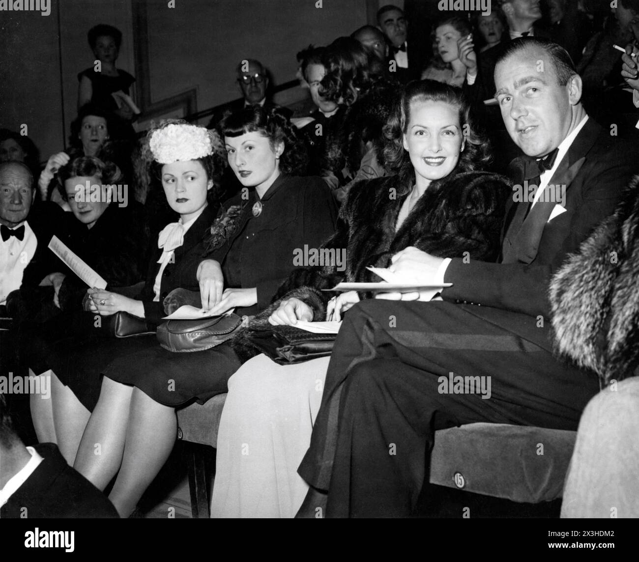 PATRICIA ROC and RONALD NEAME (at right) at the premiere at The New Gallery cinema, Regent Street, London in June 1947 of GOOGIE WITHERS JEAN KENT and JOHN McCALLUM in THE LOVES OF JOANNA GODDEN 1947 directors CHARLES FREND and (uncredited) ROBERT HAMER novel Sheila Kaye-Smith screenplay H.E. Bates music Ralph Vaughan Williams producer Michael Balcon Ealing Studios / General Film Distributors (GFD) Stock Photo