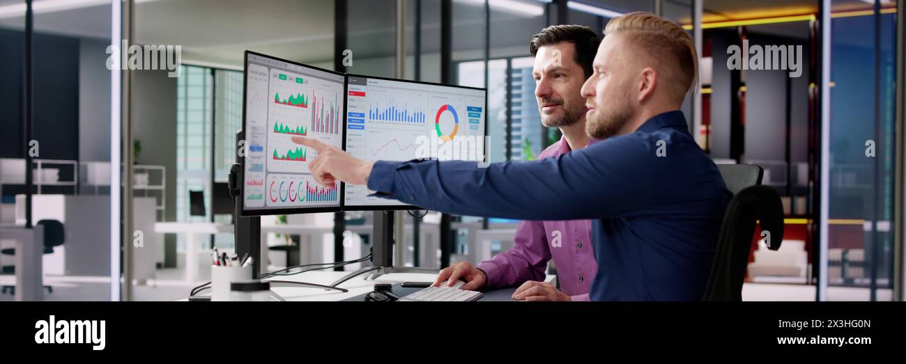 Business analyst working in office analyzing data using KPIs Stock Photo