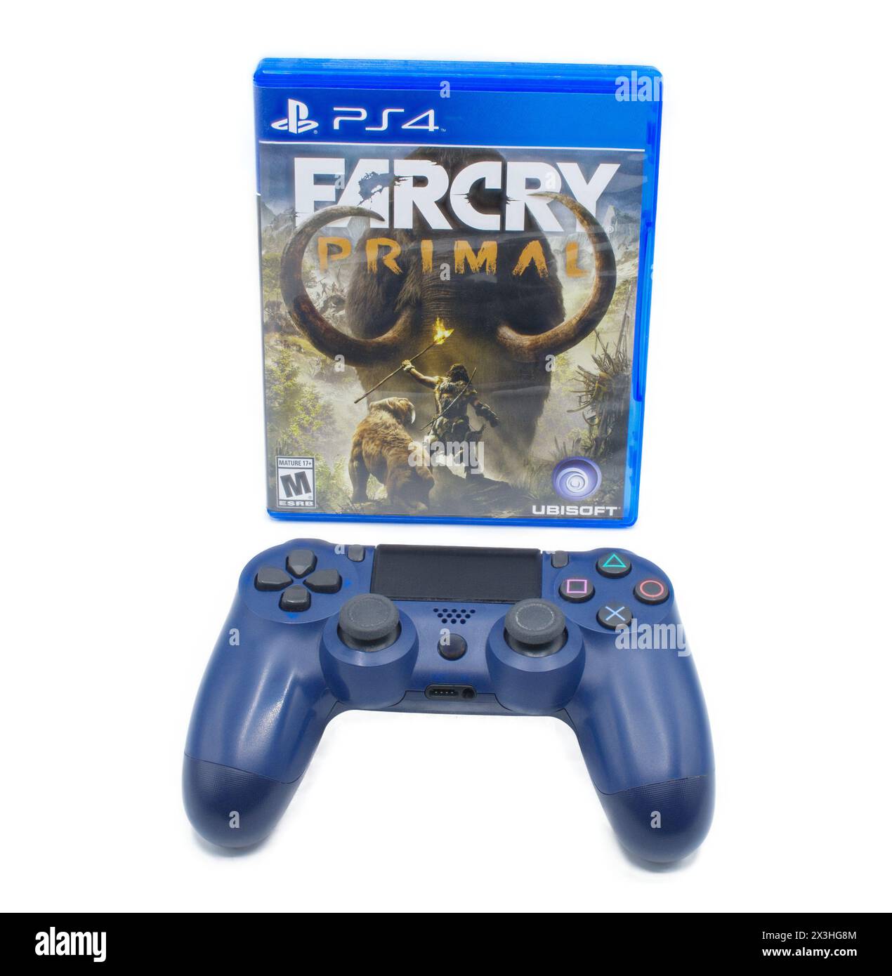 Ocala, FL 2-18-2024 Far cry primal video game by Ubisoft on Sony Playstation four 4 console with Lion, human with lit torch, and wooly mammoth on cove Stock Photo