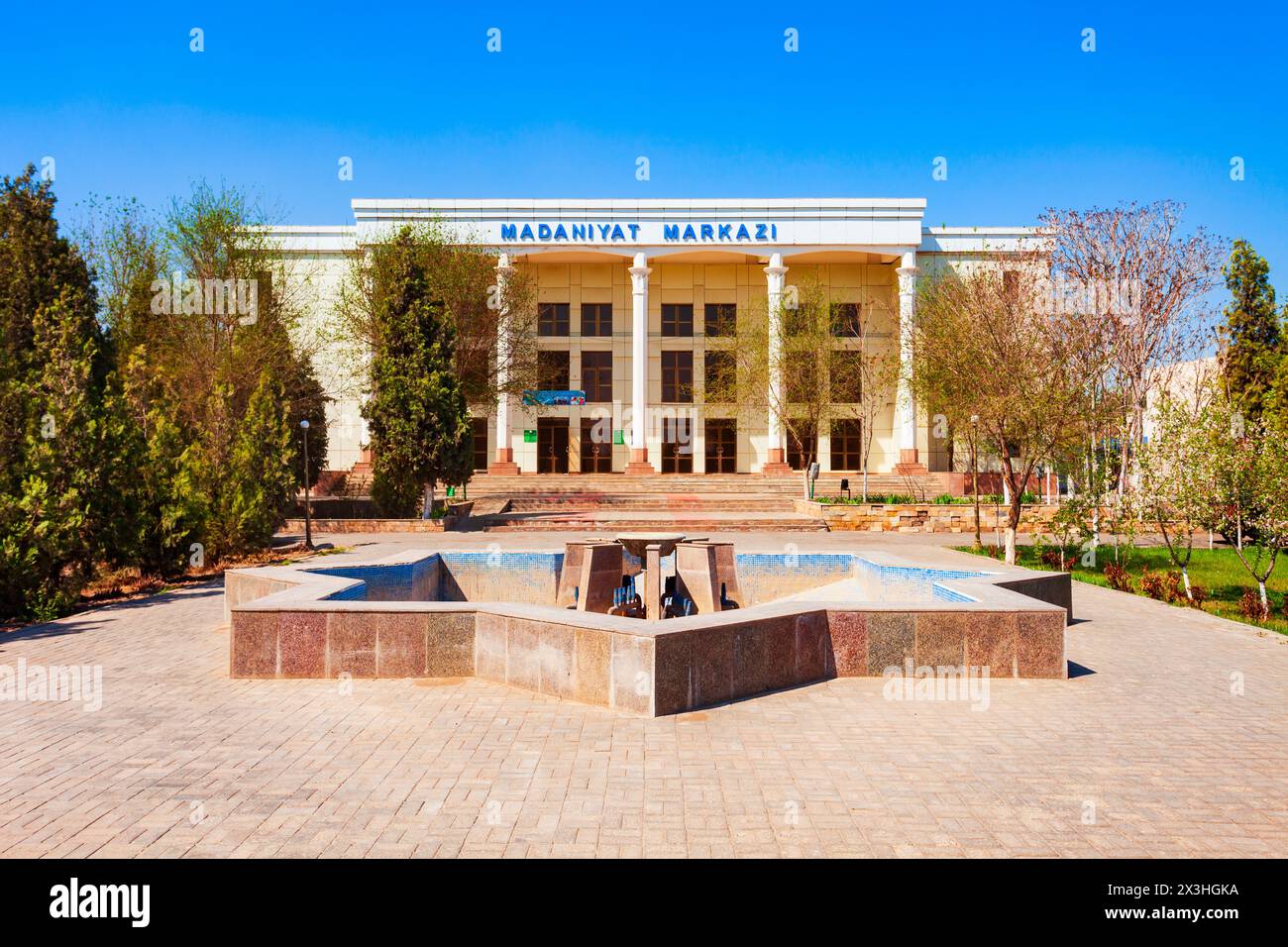 Urgench, Uzbekistan - April 13, 2021: Madaniyat Markazi or Dom Kultury is a cultural center in Urgench city, Uzbekistan Stock Photo