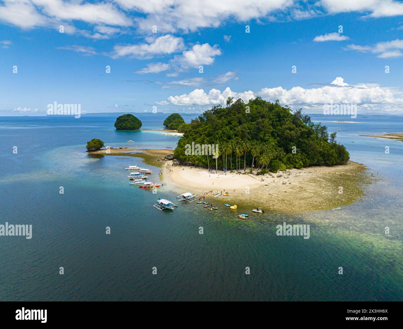 Hiyor-Hiyoran Island with white sand beach and boats. Britania Group of Islands. Surigao del Sur, Philippines. Stock Photo