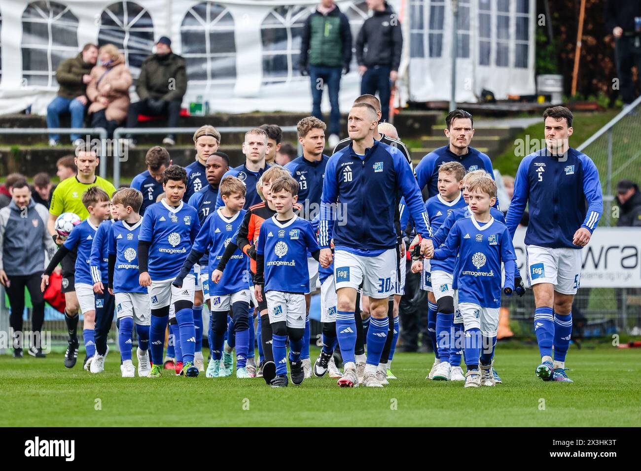 Lyngby, Denmark. 26th Apr, 2024. Marcel Romer (30) and the players of Lyngby BK enter the pitch for the Danish 3F Superliga match between Lyngby BK and Vejle BK at Lyngby Stadion in Lyngby. (Photo Credit: Gonzales Photo/Alamy Live News Stock Photo