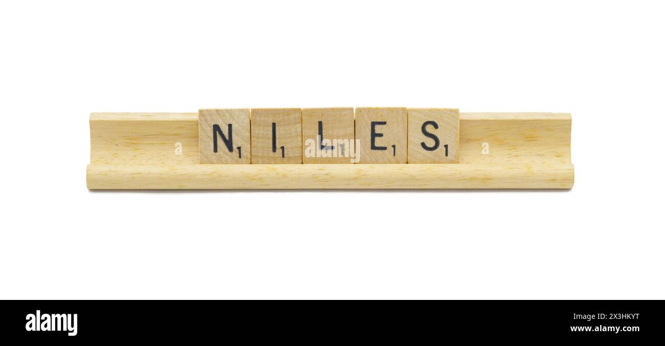 Miami, FL 4-18-24 popular baby boy first name of NILES made with square wooden tile English alphabet letters with natural color and grain on a wood ra Stock Photo