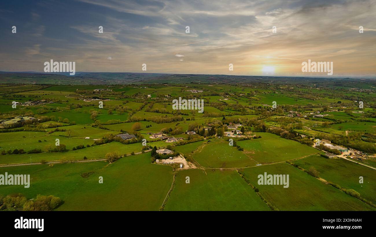 Aerial view of a lush green countryside with scattered houses and ...