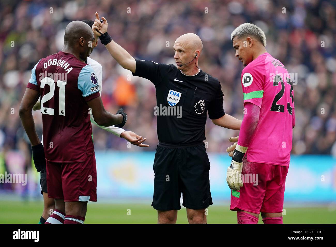 West Ham United goalkeeper Alphonse Areola (right) waits to recieve treatment for an injury