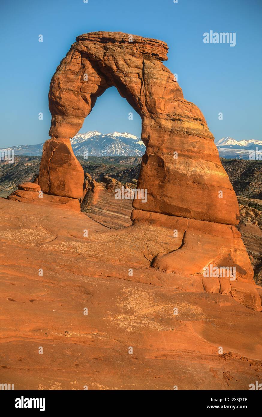 Arches National Park, Utah.  Delicate Arch.  La Sal Mountains in Background. Stock Photo