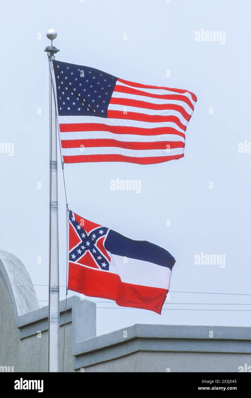 Flags of USA and Mississippi State, Tupelo, Mississippi.  On June 28, 2020 Mississippi Legislature voted to replace this flag with a new design. Stock Photo