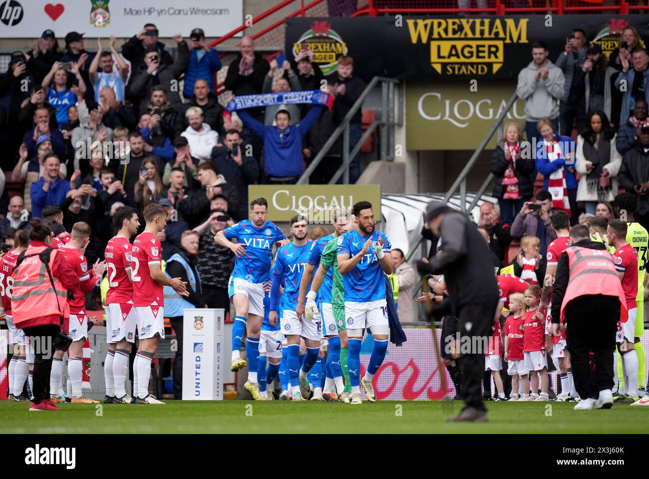 Wrexham's players give the Stockport County players a guard of honour