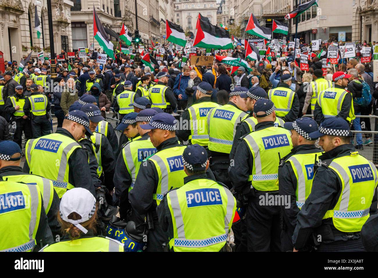 London, UK. 27th Apr, 2024. A Heavy Police presence. National March for Palestine. The March is organized by Palestine Solidarity Campaign and Friends of Al Aqsa and an estimated 100,000 protesters are calling for an immediate ceasefire and end to the bombing of Gaza by Israel. They also want the Government to stop supplying arms to Israel. Along the route to Hyde Park, there is a counter Israeli protest asking for the release of the hostages and calling Hamas terrorists. Credit: Mark Thomas/Alamy Live News Stock Photo