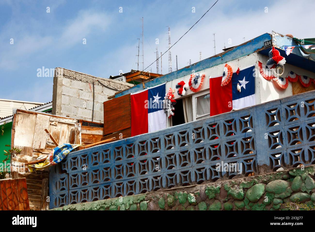 House decorated with Chilean flags for the bicentenary of the establishment of the First Government Junta of Chile on 18th September 1810, Arica Stock Photo