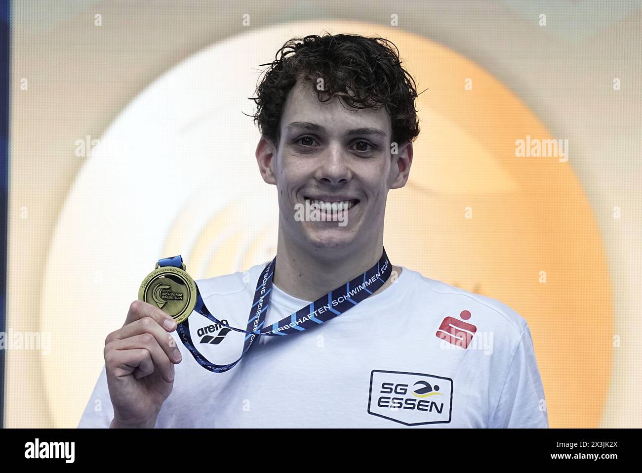 Berlin, Germany. 27th Apr, 2024. Swimming: German Championships, decision: 200 meter medley men. Cedric Büssing celebrates with his gold medal. Credit: Michael Kappeler/dpa/Alamy Live News Stock Photo