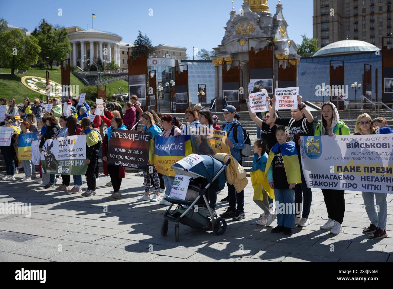 Kyiv, Ukraine. 27th Apr, 2024. Relatives of currently enlisted Ukrainian servicemen hold placards during a rally calling for demobilization terms to be set up, at the Independence Square in Kyiv. People gathered to demand the terms of length of service in the army, being on the frontline, and fair rotation. The demobilization terms are not prescribed in a new mobilization law which was adopted by the Ukrainian Parliament and signed by President Zelensky recently. (Photo by Oleksii Chumachenko/SOPA Images/Sipa USA) Credit: Sipa USA/Alamy Live News Stock Photo
