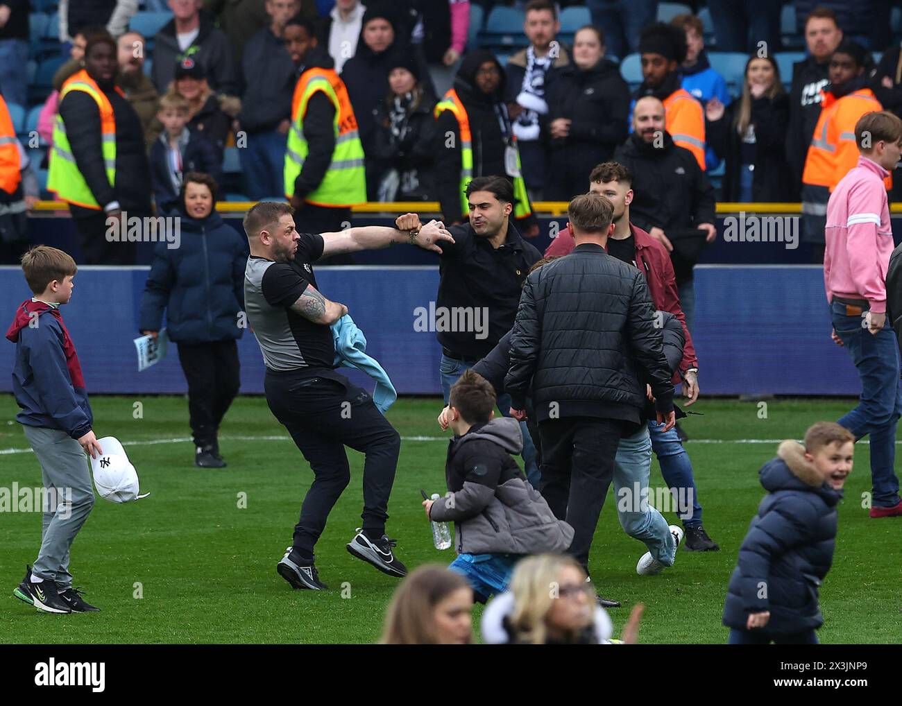 The Den, Bermondsey, London, UK. 27th Apr, 2024. EFL Championship Football, Millwall versus Plymouth Argyle; Millwall fans fighting each other during a pitch invasion after full time Credit: Action Plus Sports/Alamy Live News Stock Photo