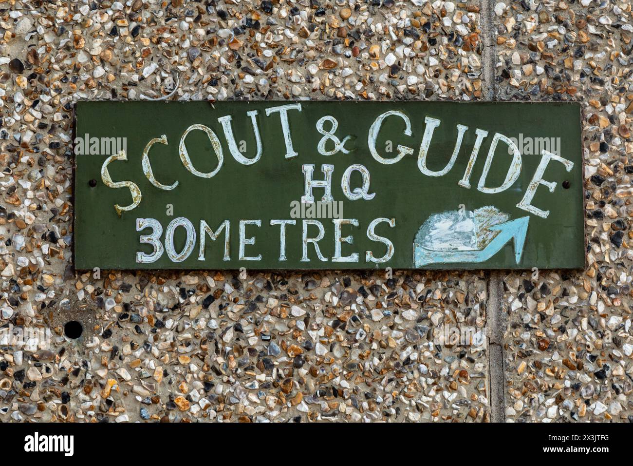 Weathered sign for Scout and Guide HQ in Great Shelford, Cambridgeshire, England, UK Stock Photo