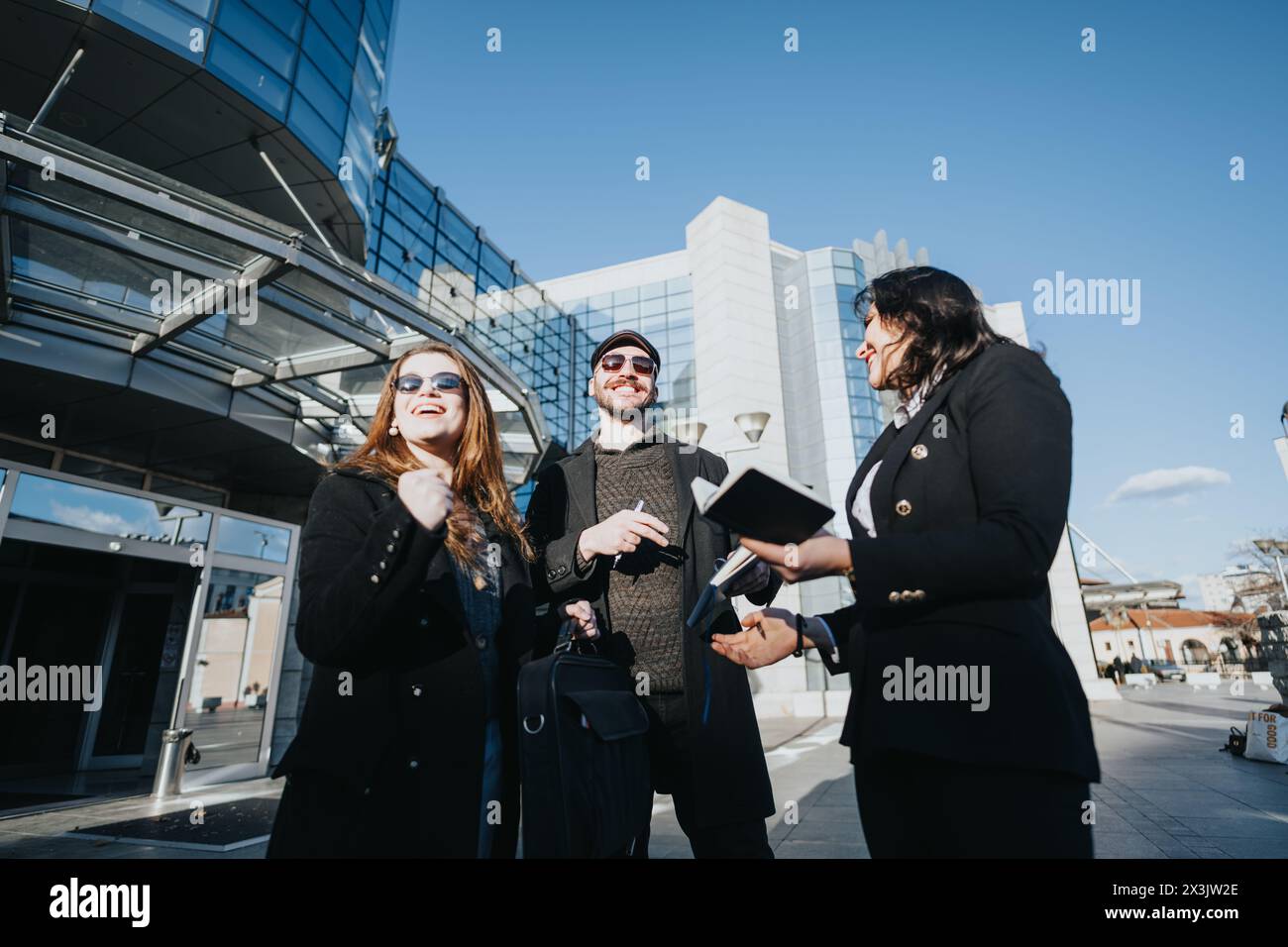 Three young professionals collaborate hi-res stock photography and ...