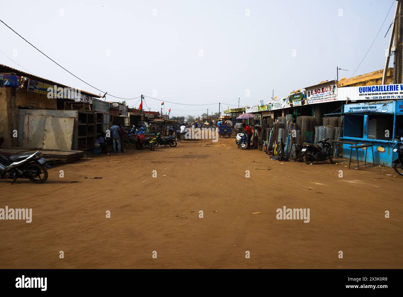 bustling businesses on a dirt road, ouagadougou, burkina faso Stock Photo