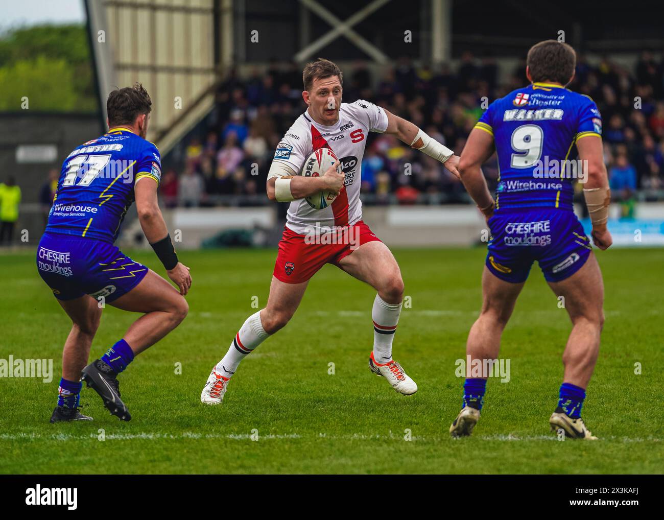 Salford, Manchester, UK. 27th April, 2024. Super League Rugby: Salford Red Devils Vs Warrington Wolves at Salford Community Stadium. ANDREW DIXON looking to create space between DANNY WALKER AND JORDY CROWTHER. Credit James Giblin/Alamy Live News. Stock Photo