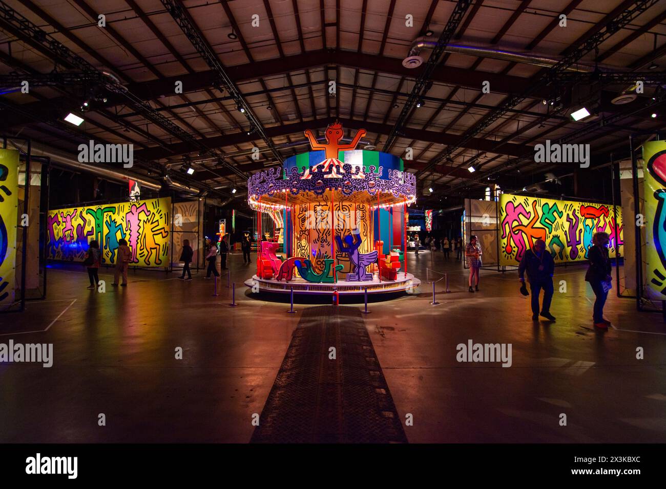 Industrially fabricated tarps and a painted carousel by Keith Haring