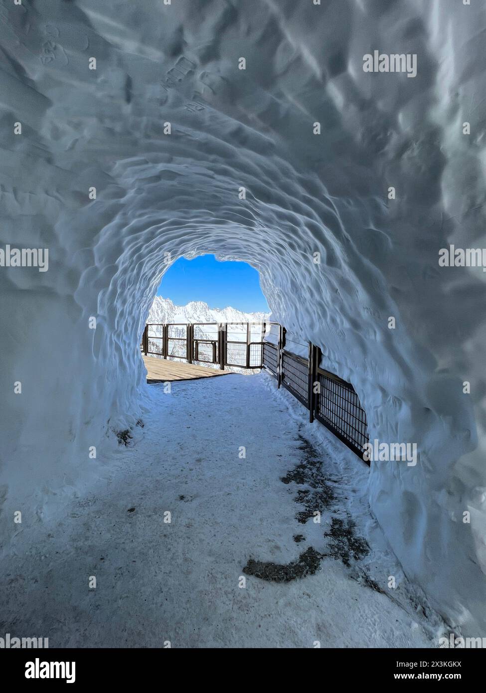 Haute-Savoie, France: ice tunnel on the top of L’Aiguille du Midi, the highest spire (3.842 m) of the Aiguilles de Chamonix in the Mont Blanc massif Stock Photo