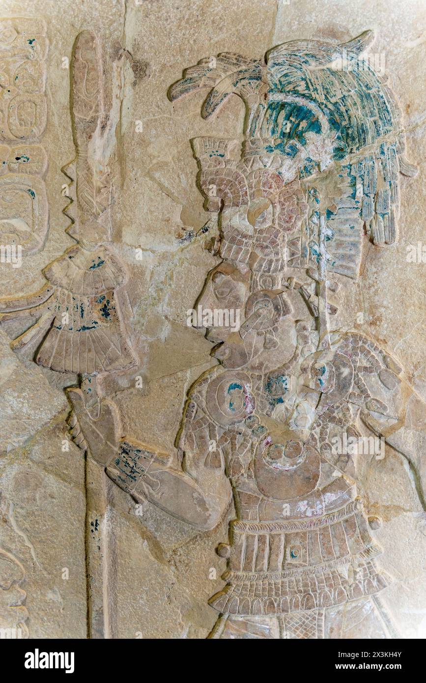Mayan bas relief carving in stele tombstone of Mayan ruler king with staff of power, Palenque. Stock Photo