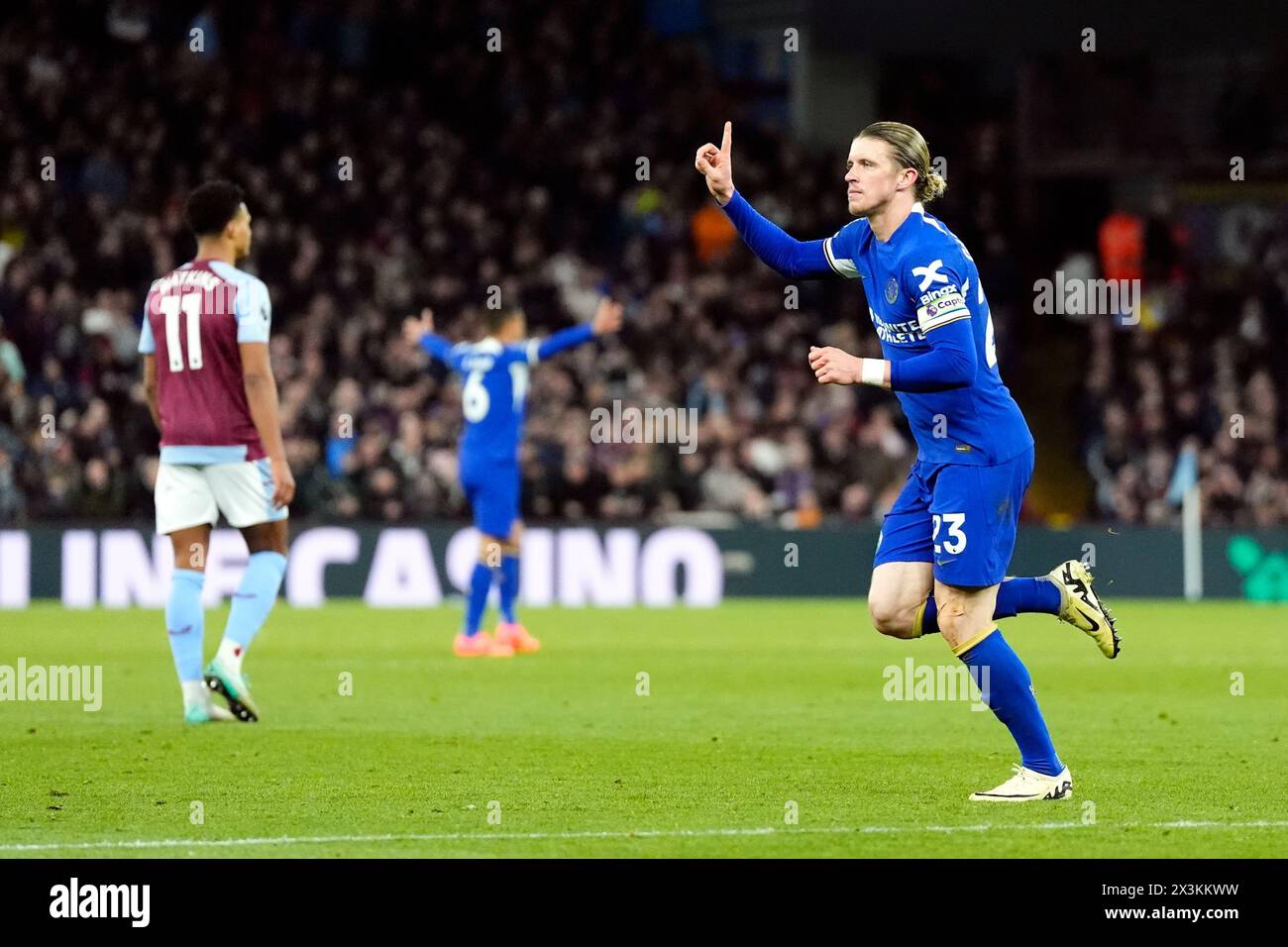 Chelsea's Conor Gallagher (right) celebrates scoring their side's second goal of the game as Aston Villa's Ollie Watkins looks frustrated during the Premier League match at Villa Park, Birmingham. Picture date: Saturday April 27, 2024. Stock Photo