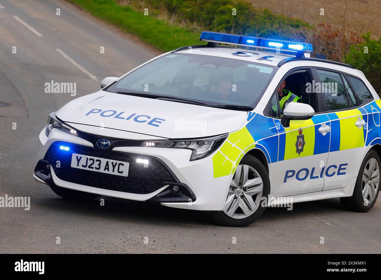 A hybrid police vehicle being used as a road block at an incident in Swillington,West Yorkshire,UK Stock Photo