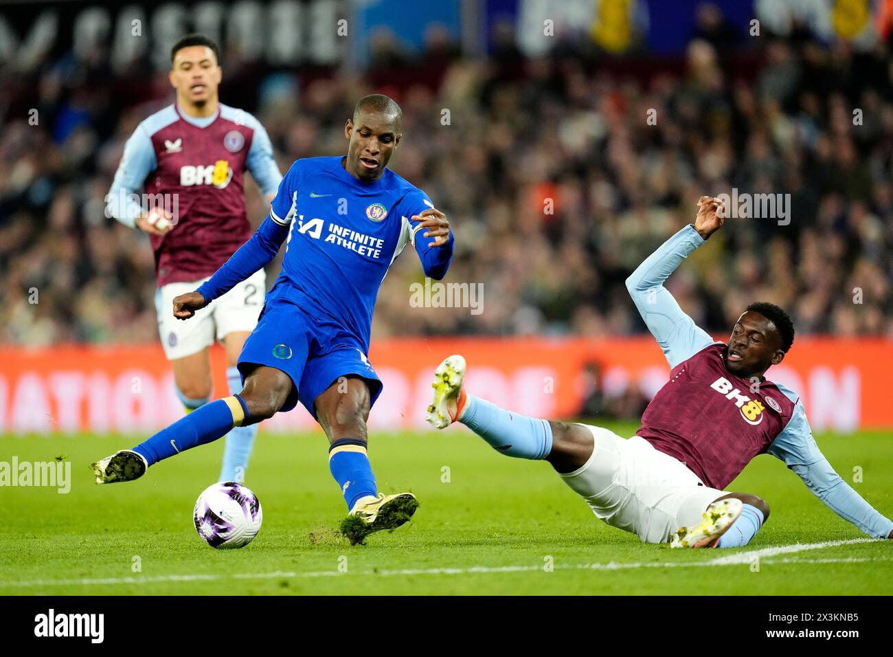 Chelsea's Nicolas Jackson and Aston Villa's Tim Iroegbunam appear to slip while battling for the ball during the Premier League match at Villa Park, Birmingham. Picture date: Saturday April 27, 2024. Stock Photo