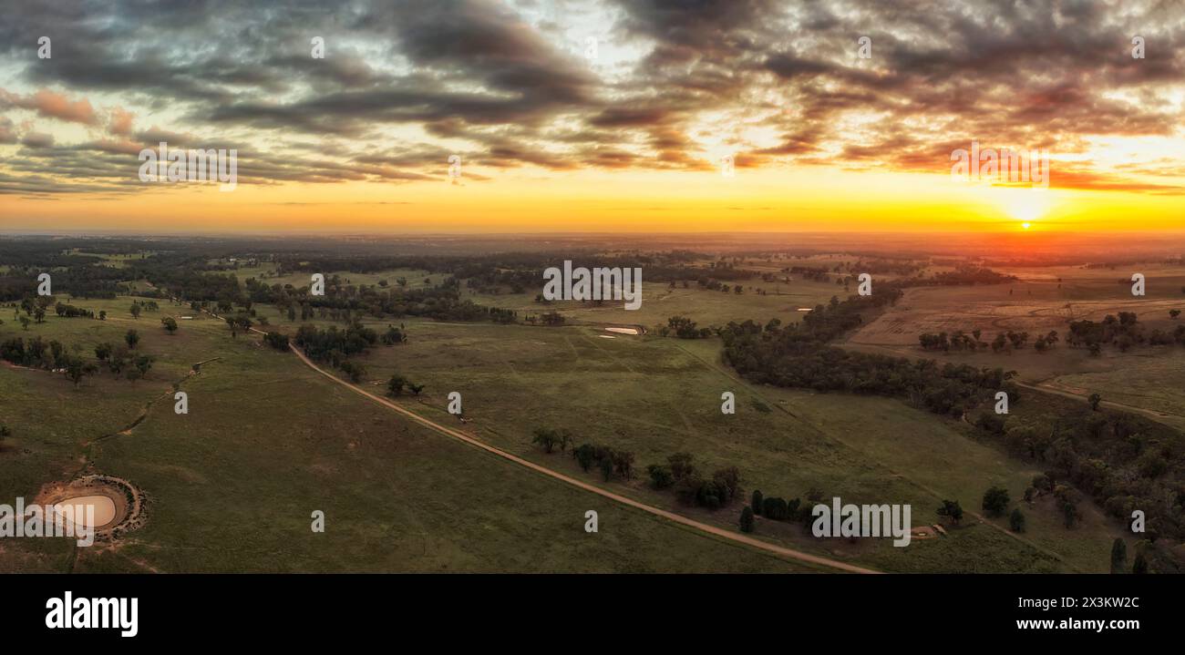 Scenic argiculture farm fields of Western Plains around Dubbo city of NSW, Australia - aerial sunrise panorama. Stock Photo