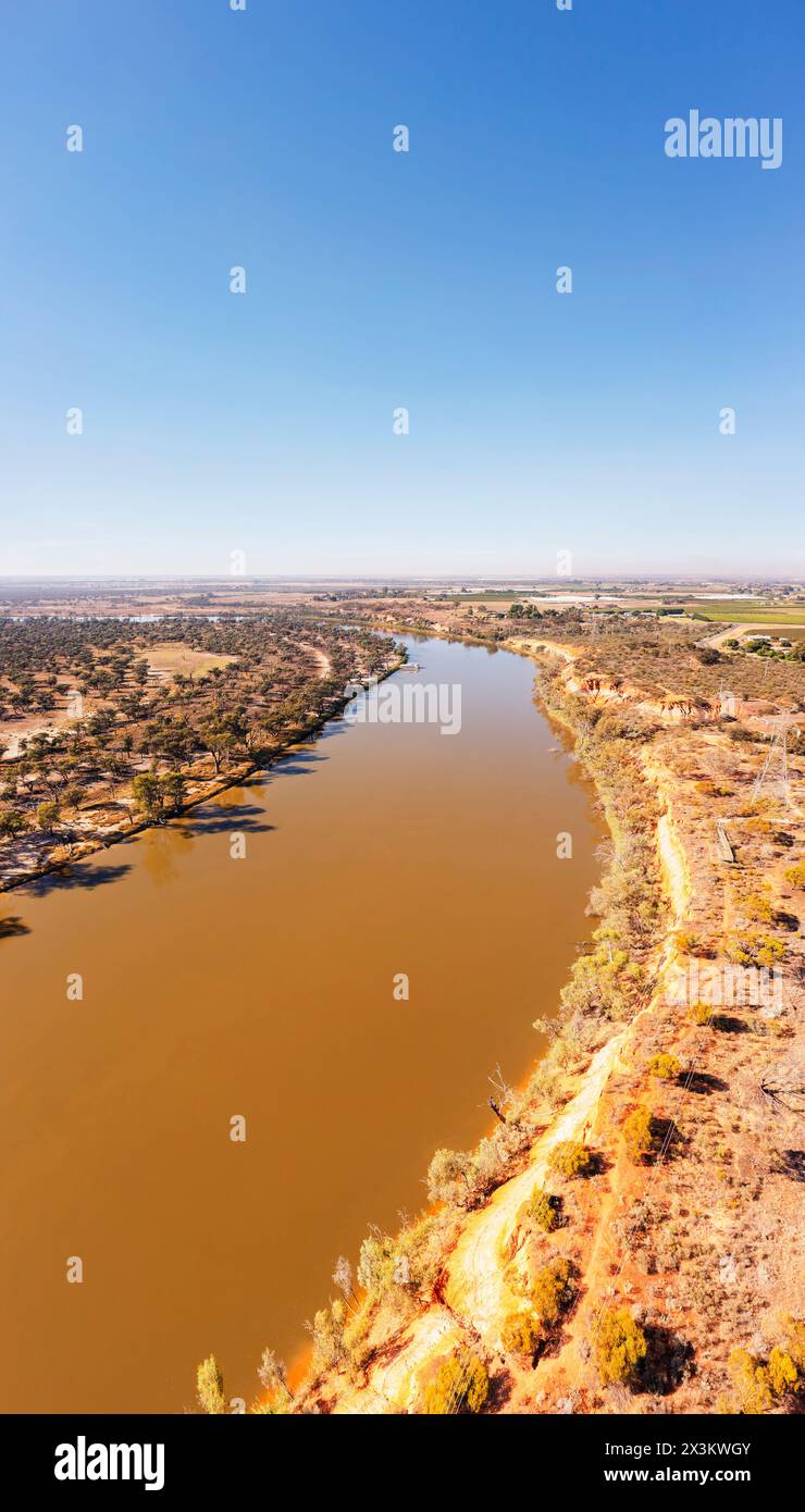 Flow of lazy slow Murray river at Red Cliff - scenic vertical panorama. Stock Photo
