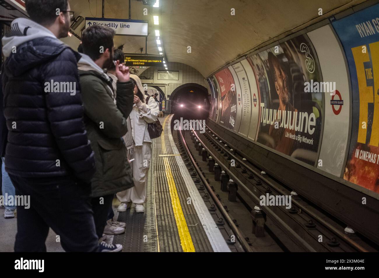 27th April 2024, London - Underground train pulls into Leicester Square Stock Photo