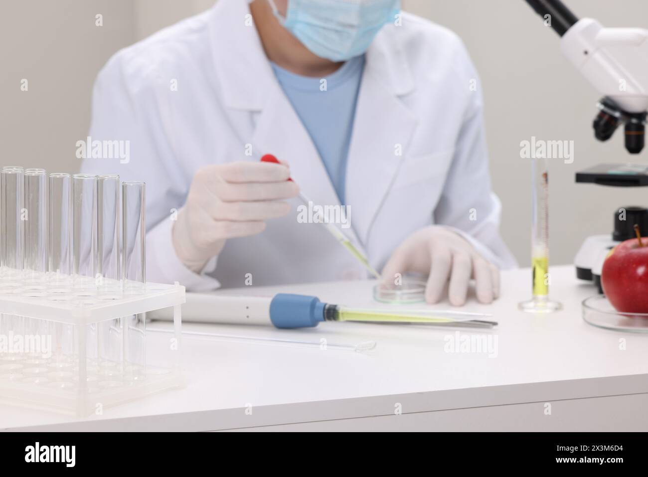 Quality control. Food inspector working in laboratory, focus on test ...