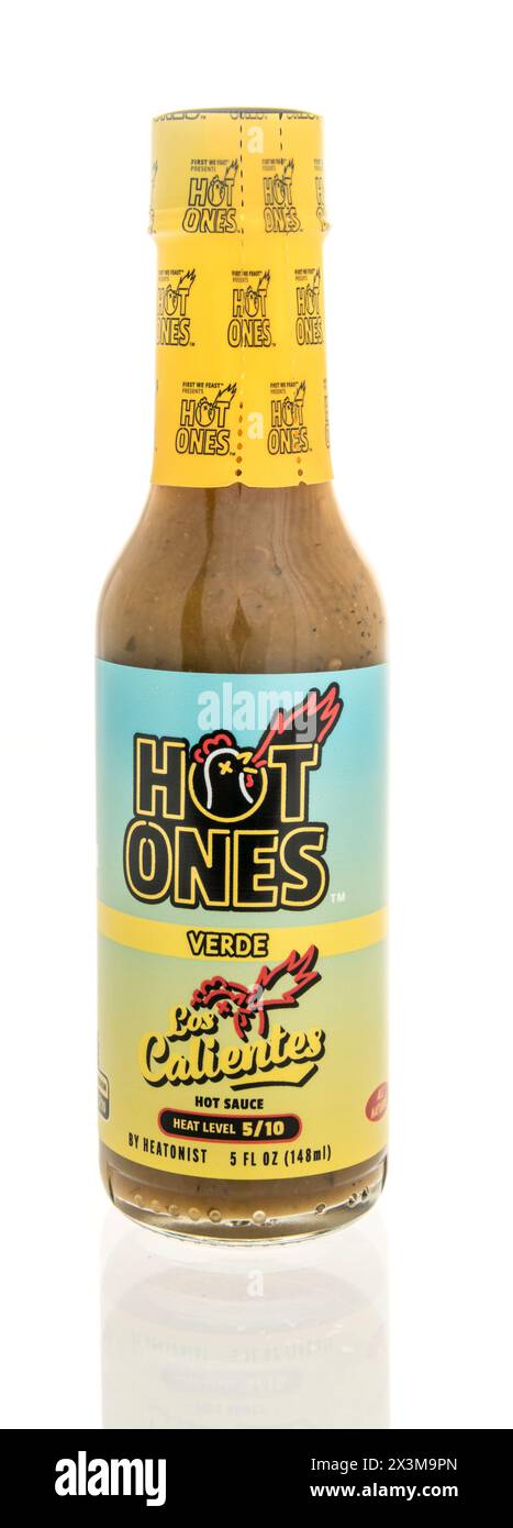 Winneconne, WI - 27 April 2024: A bottle of Hot ones verd los calientes hot sauce on an isolated background. Stock Photo