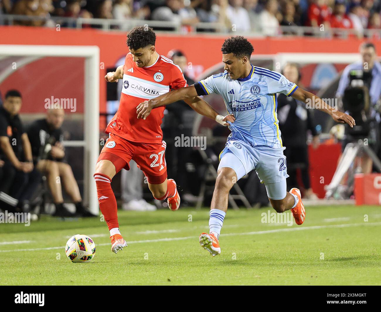 Chicago, USA, 26 April 2024. Major League Soccer (MLS) Chicago Fire FC's Allan Arigoni (27) fights for the ball against Atlanta United FC's Caleb Wiley (26) at Soldier Field in Chicago, IL, USA. Credit: Tony Gadomski / All Sport Imaging / Alamy Live News Stock Photo