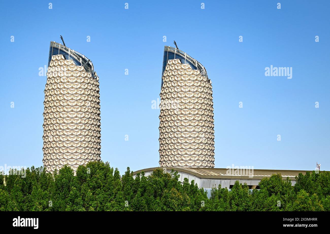 ABU DHABI - MAR 28: Eco friendly two Al Bahr Towers in Abu Dhabi on March 28. 2024 in UAE Stock Photo